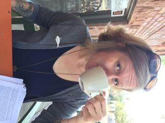 picture of woman with blond hair drinking coffee