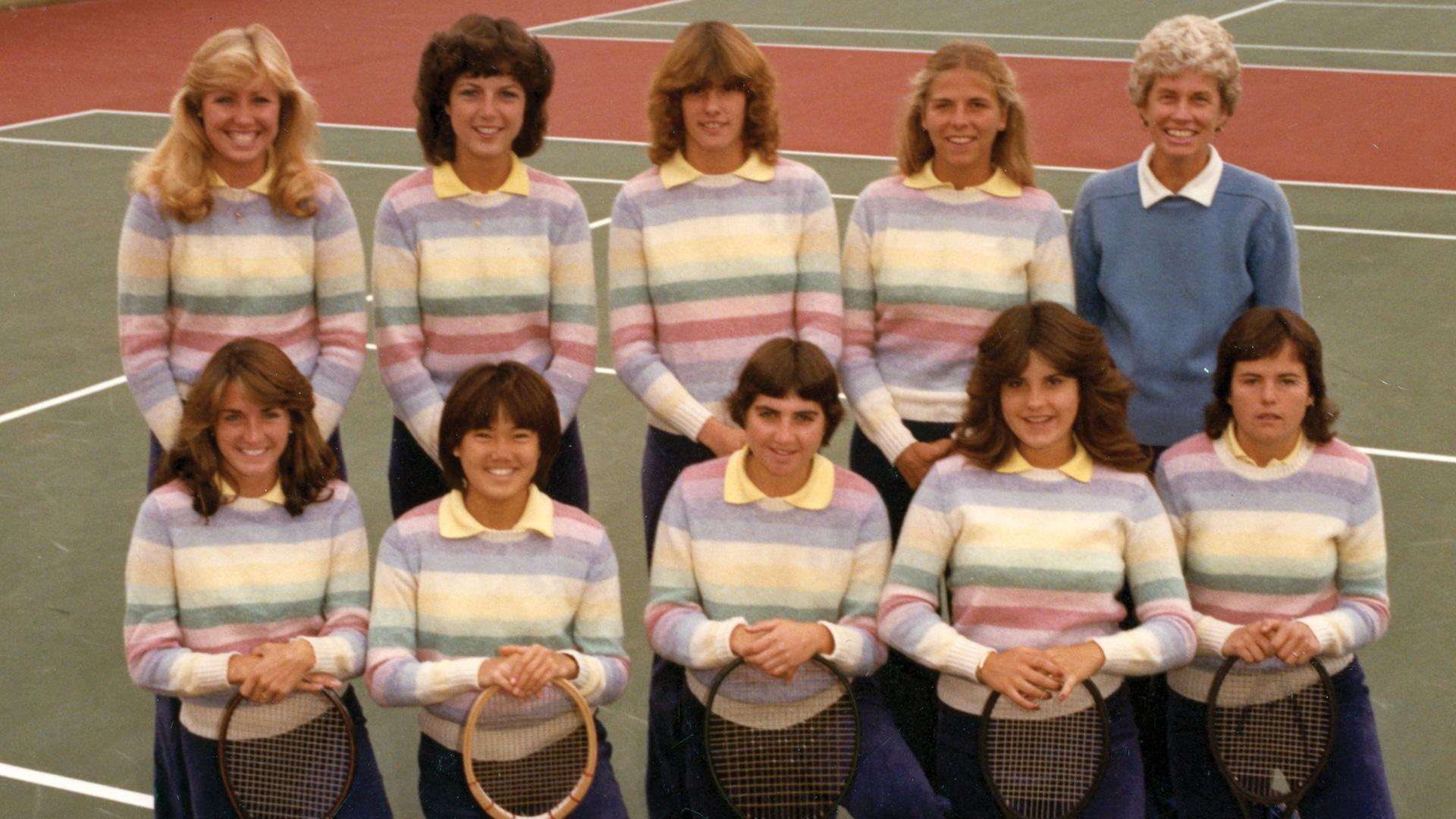 1984 UNC Tennis Team pose together with their tennis raquets.